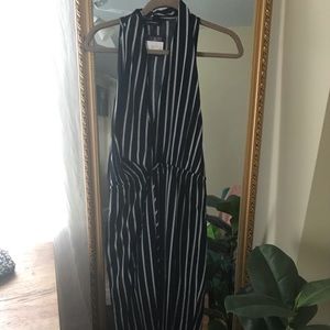 navy + white jumpsuit with plunging neckline